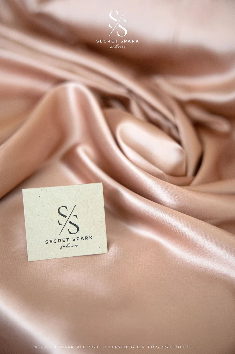 Online Fabric Store Iconic Silky Satin - Rose Gold Color Trendy One Way Stretch Fabric for Sewing Bridal Dresses, Silk Slips, Event Tablecloths | Satin Fabric | Irvine, US Secret Spark Fabrics Online Fabric Store Iconic Silky Satin - Rose Gold Color Trendy One Way Stretch Fabric for Sewing Bridal Dresses, Silk Slips, Event Tablecloths | Satin Fabric | Irvine, US Secret Spark Fabrics