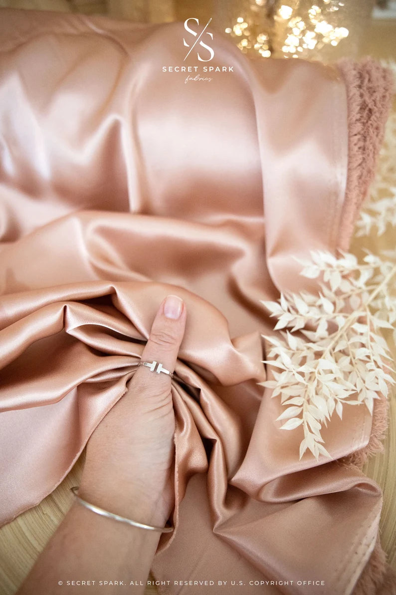 Online Fabric Store Iconic Silky Satin - Rose Gold Color Trendy One Way Stretch Fabric for Sewing Bridal Dresses, Silk Slips, Event Tablecloths | Satin Fabric | Irvine, US Secret Spark Fabrics Online Fabric Store Iconic Silky Satin - Rose Gold Color Trendy One Way Stretch Fabric for Sewing Bridal Dresses, Silk Slips, Event Tablecloths | Satin Fabric | Irvine, US Secret Spark Fabrics